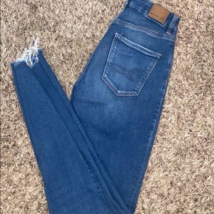 American Eagle ultra High rise jeggings, curvy fit size 2. Distressed bottoms
